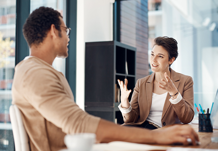 female manager talking to male employee